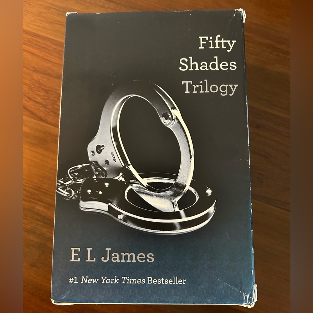 Fifty Shades Trilogy by E L James; great used condition. All 3 paperback books.